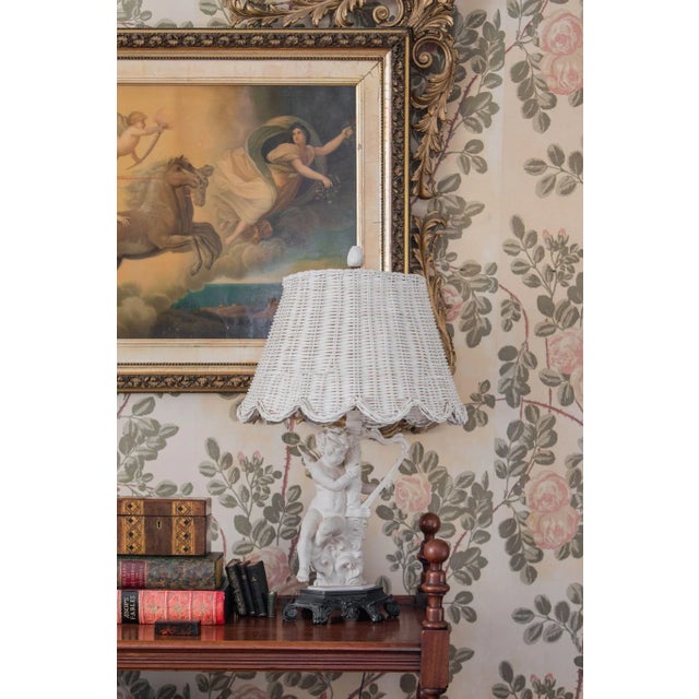 Handwoven rattan lampshade with signature Maison Maison scallops along bottom and harp fitting. 10″T x 16″B x 10″H