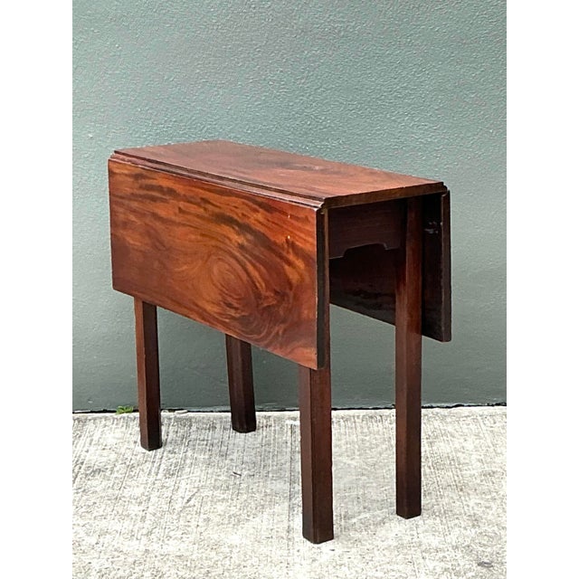 This elegant vintage drop-leaf table showcases the timeless appeal of traditional American craftsmanship. Hand-finished in...