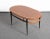 Beautiful Mid-Century oval coffee table in Iron and Teak Wood. This item was designed in Italy during 1950s by Silvio...