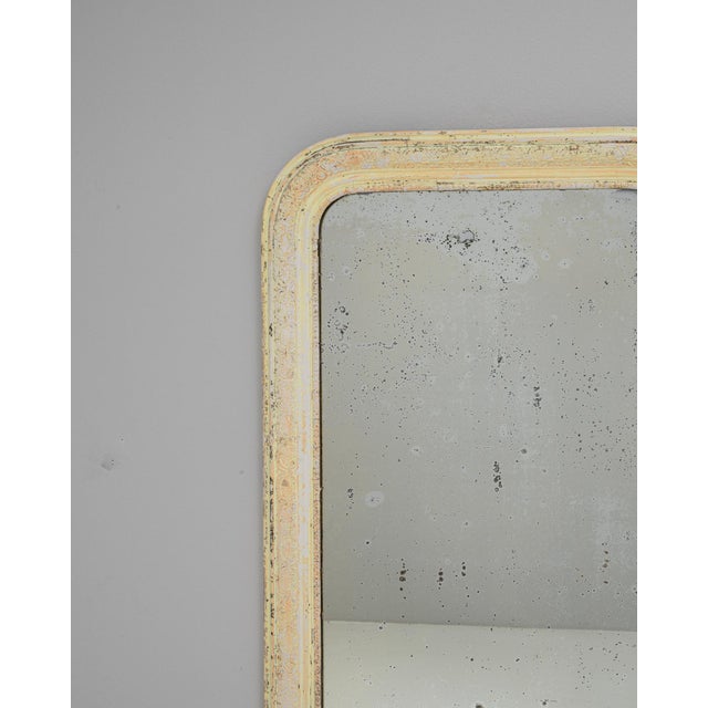 This 1880s French wood patinated mirror features a classic rounded-top silhouette and a beautifully distressed frame that...