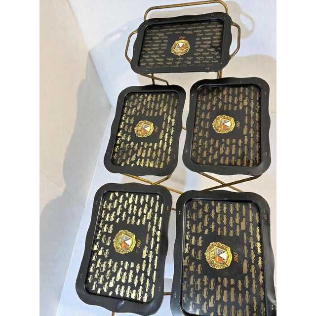 dd a touch of vintage charm to your space with this 1950s metal TV tray set, featuring three trays with hand-painted...