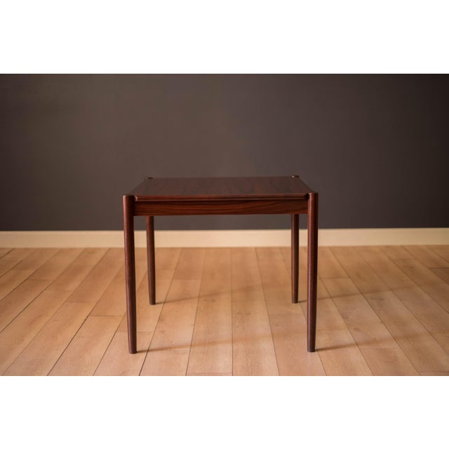 Mid Century Modern flip top card game table in rosewood by Kibaek Mobelfabrik, Denmark circa 1970's. This versatile piece...