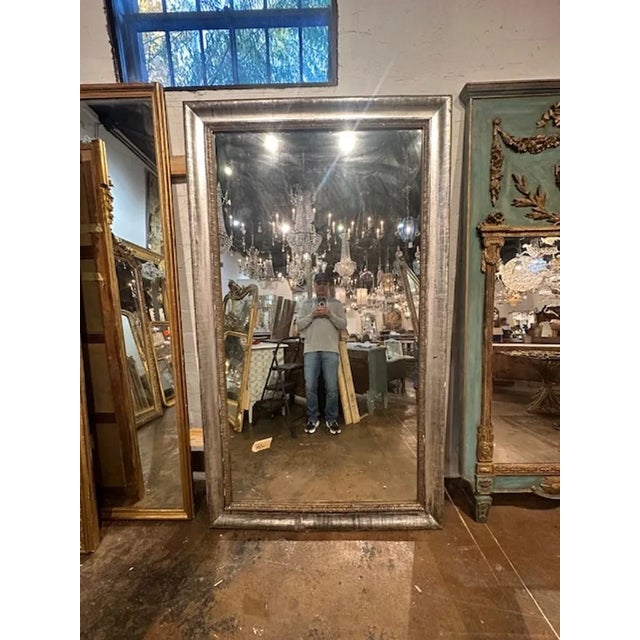 19th century French Directoire' large scale silver leaf floor mirror. Circa 1880. A favorite of top designers!