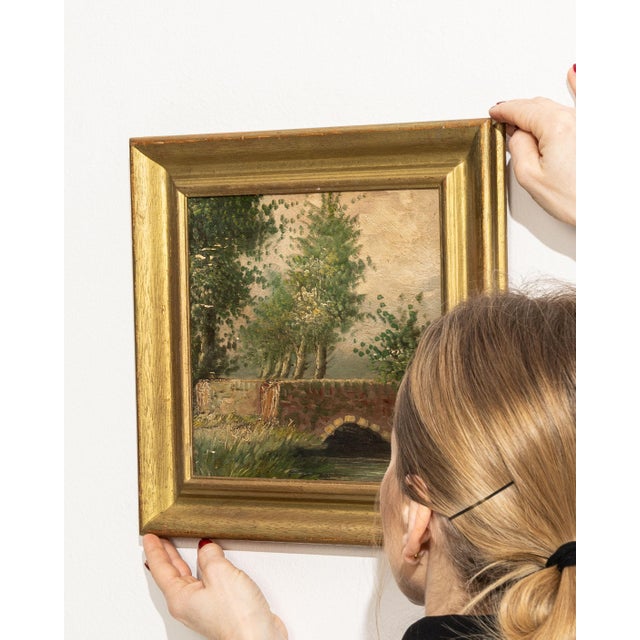 This 1930s painting from Belgium is an oil on panel, housed in a wood frame. It is distinguished by its bridge by j....