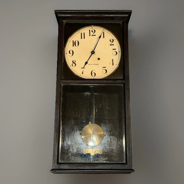 This listing is for a large antique American regulator wall clock by Seth Thomas. The clock has an 8 day time only...