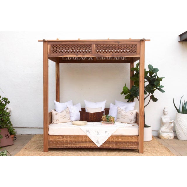 This monumental canopy daybed is a masterwork of sustainable design, meticulously handcrafted from architectural reclaimed...