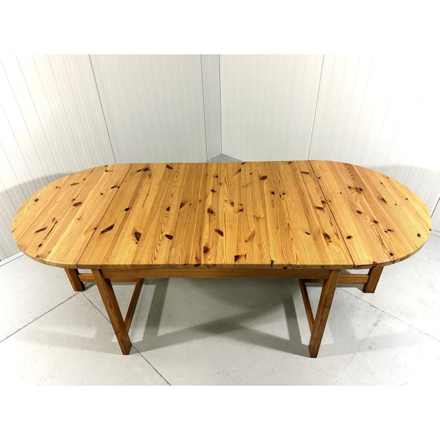 Very large drop-ear dining table by Karin Mobring for Ikea. Pinewood with nice woodjoints in the drop-ear tops. The table...