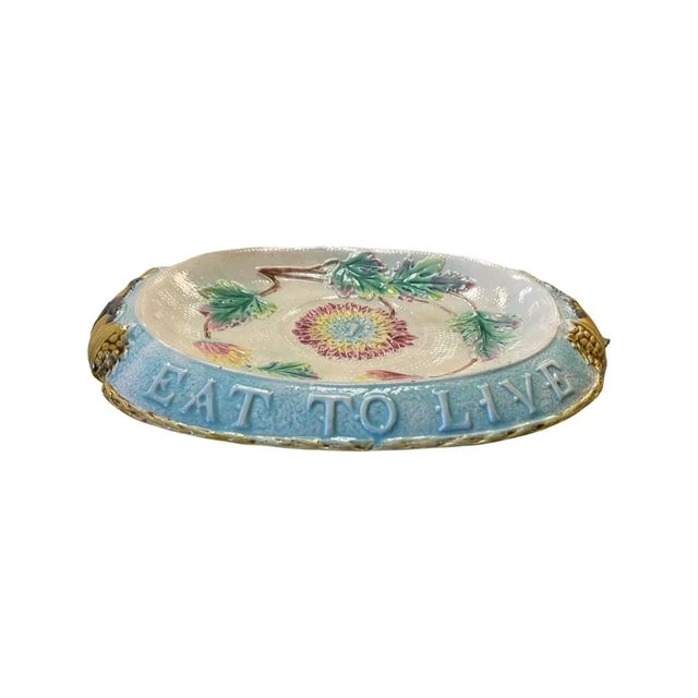 Late 19th Century White, Sky Blue Majolica Bread Plate. White Center with Pink, Green and Yellow Floral/Leaf Design. "Eat...