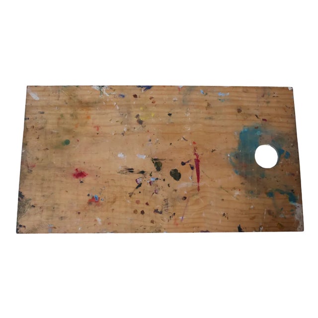 Carved from richly grained wood in the mid-1900s, this oversized artist’s palette still bears sweeping arcs of cured...