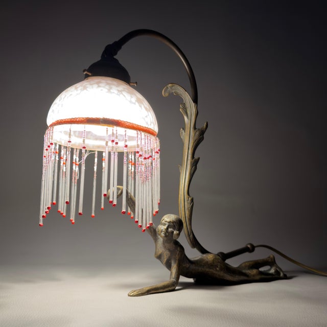 An exceptional and rare lighting accessory that captures the essence of early 20th-century elegance. This exquisite...