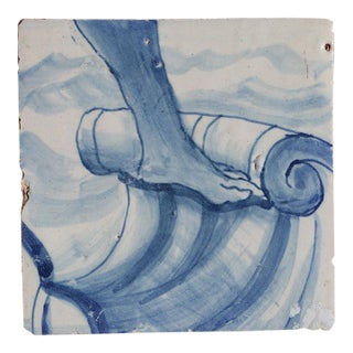 Antique 18th Century Blue and White Portuguese Tile Depicting a Foot on a Rocaille Ribbon For Sale