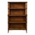 This is a late 20th century regency revival style faux bamboo bookcase. It has faux bamboo carved spindles, the top two...