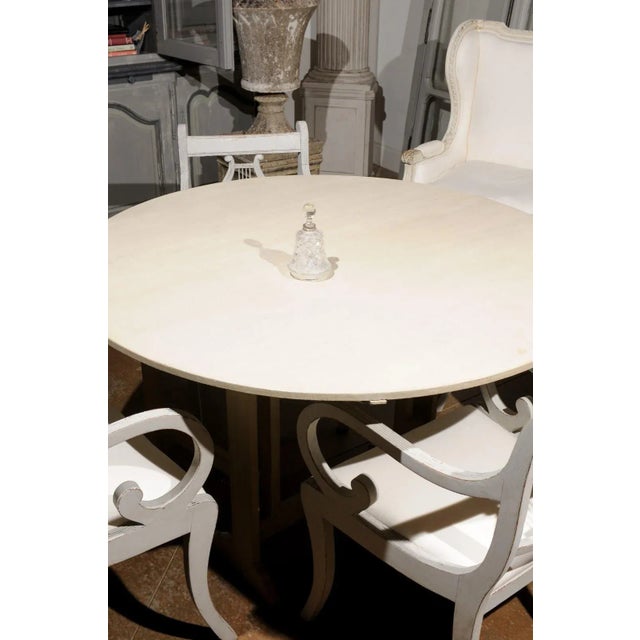 A small French crystal toiletry bottle from the early 20th century, with silver neck and faceted stopper. Born in France...