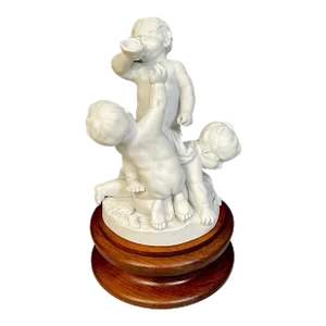 19th Century Sevres Biscuit Group of Three Frolicking Puttos