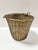 A finely woven vintage solid brass basket with sculptural looped swing handles and a rich, naturally aged patina. The...