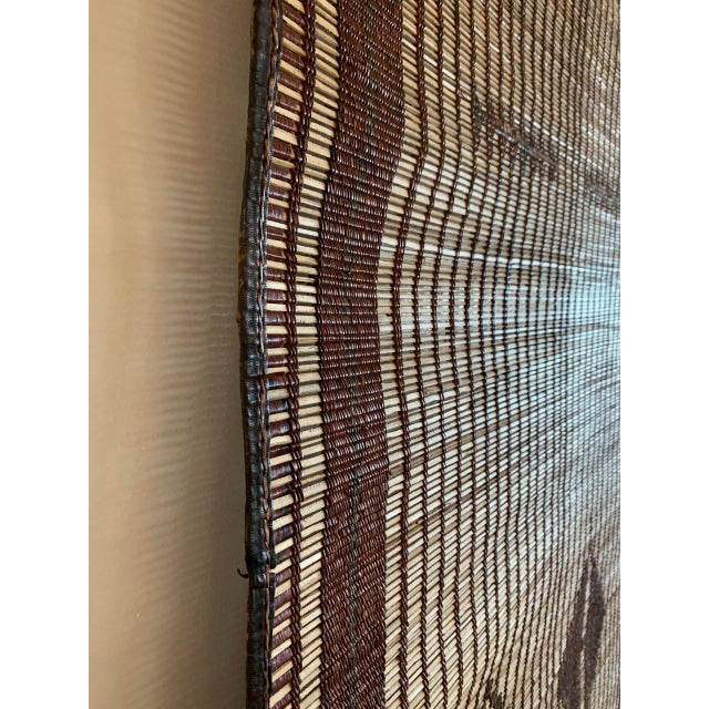 VINTAGE TUAREG MAT, 6′ 8″ X 11’7″ Hand-woven from slender reed and fine strips of camel leather, Taureg mats from...