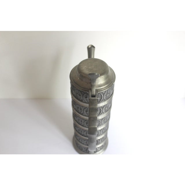 This has such a great pattern it would look great on an open shelf to add texture. Tall pewter coffee pot of lidded...