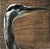 The painting features a striking close-up of a heron's head, capturing the elegant curve of its neck and sharp profile...