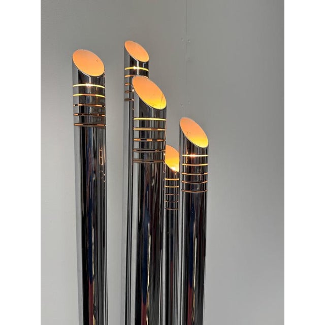 A sculptural five arms solid chrome tubular floor lamp designed c1965 by gaetano sciolari . Italy this piece is attributed...
