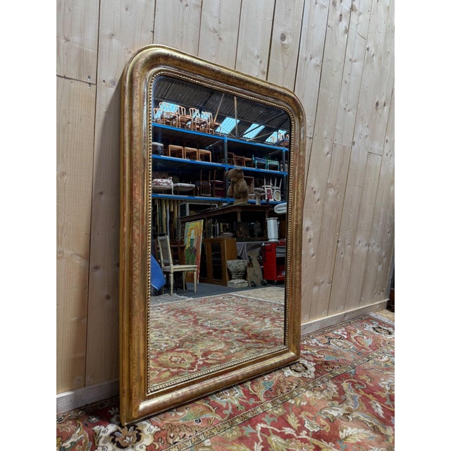 Large Louis-Philippe period mantel mirror (circa 1830-1850), rectangular in shape with rounded upper corners,...