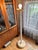 Elevate your space with this striking Olympia Lunar 1 vintage floor lamp. This Mid-Century Modern white “lollipop” floor...