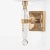 Brass and crystal sconce with linen shade.