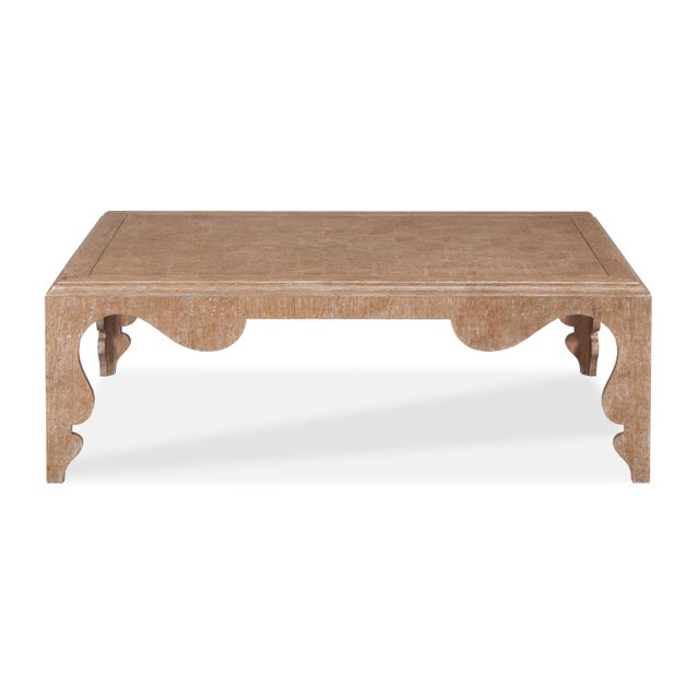 A refined balance of form and texture, this hand-carved coffee table features a cerused oak finish that accentuates its...