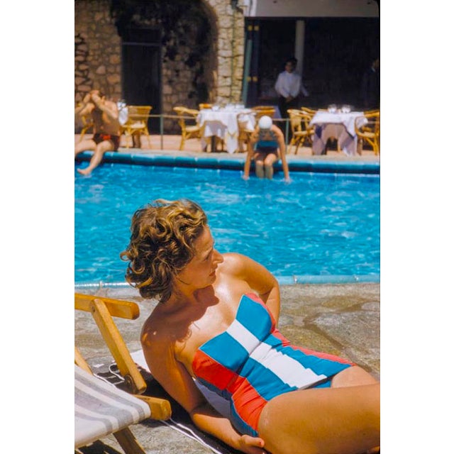 Poolside In Capri by Toni Frissell A chic,swimsuited holiday maker poolside in Capri, Italy, 1959. (Photo by Toni...
