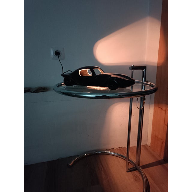Exquisite vintage lamp. American car, sports coupe. All black ceramic, chrome-plated metal base. Beautiful reflections...