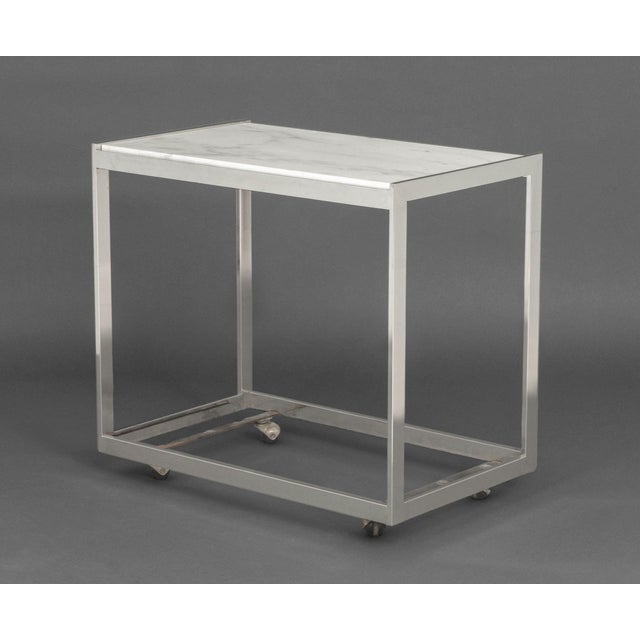 Modern Carrara White Marble Top Chrome Side Table, on casters. 28" H x 30.5" W x 19.25" D. Provenance: From a Westchester...