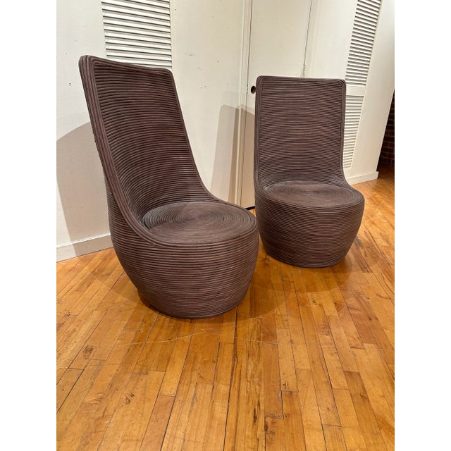 Fabulous, tall back, large pencil Reed rattan chairs. This rich brown color and organic texture will add a warmth to any...