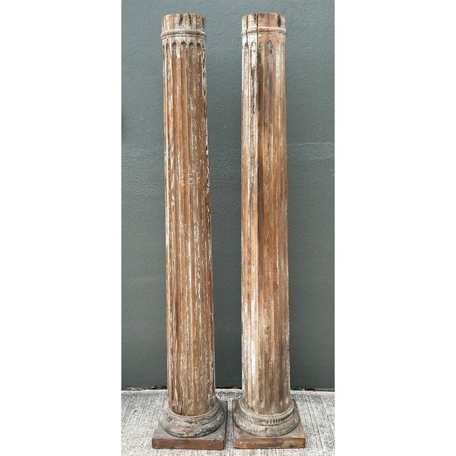 This striking pair of vintage wooden architectural columns embodies the timeless elegance of classical design, featuring...