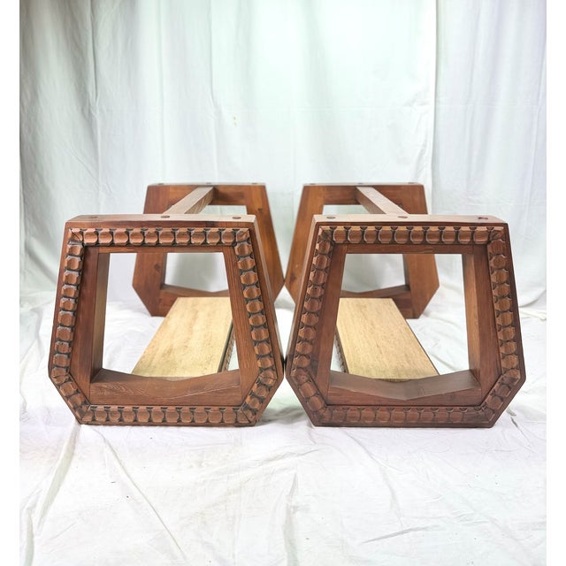 Extraordinary Pair of 70's Brutalist end tables which appear to be crafted from solid walnut are defined by a highly...