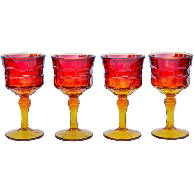 Rare set of 4 midcentury heavy handblown glasses with ornate reddish orange color variation and elegant textured pattern....