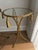 Mid-century pair of Italian gilded aluminum tables with the rope twist and tassel design. Each table has a glass insert....