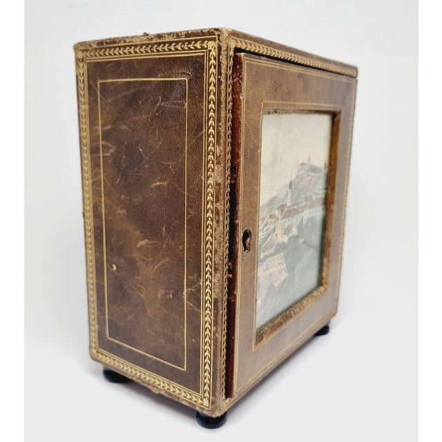 Jewelry box from the beginning of the 20th century. 3 drawers, a cityscape in the mirror, which is a paper print. A...