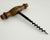 Wonderful antique French cork screw with wood handle and steel screw, both with lovely aged patina. Unmarked.