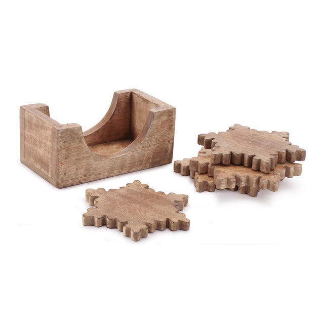 Protect your surfaces in seasonal style with this Wood Snowflake Coasters with Holder set. Crafted from natural wood and...