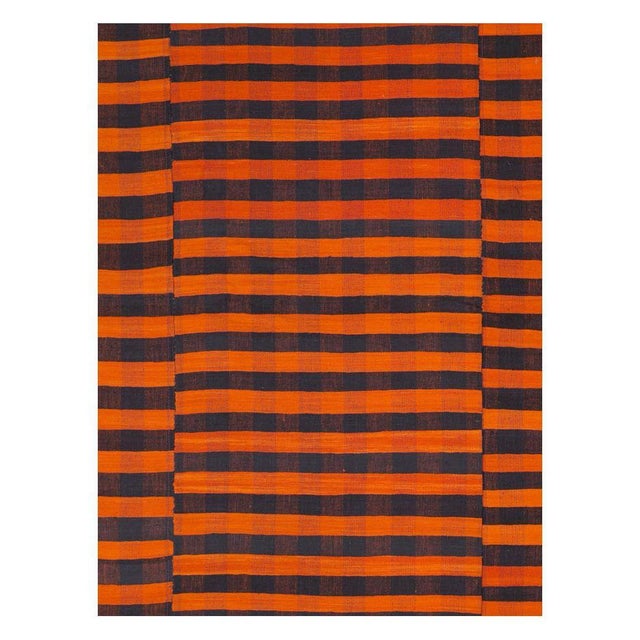 A vintage Turkish flat-weave Kilim room size accent rug handmade during the mid-20th century with a striped design in...
