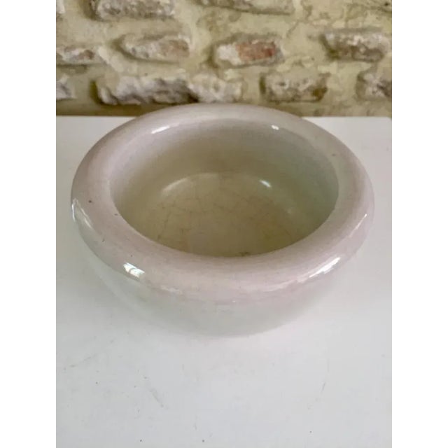 KERAMOS, SEVRES, Circular bowl, in ivory-colored cracked ceramic, thick, massive, heavy, very Jouvesque, from the 1950s....