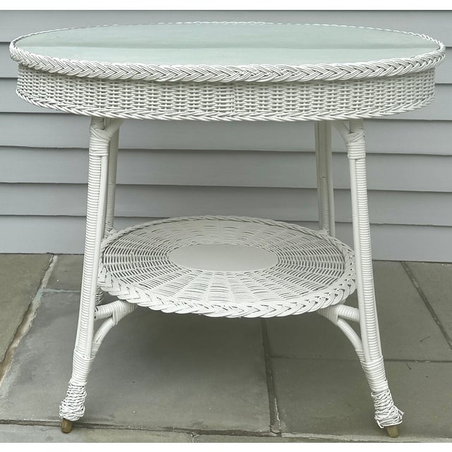 Circa 1890 wicker table by New England Reed Co., Boston. Professionally refinished in Benjamin Moore’s Sea Pearl with hand...