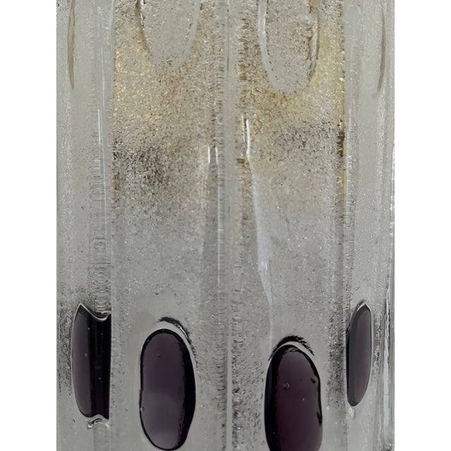 Gorgeous and lovely pair of italian lilac murano glass wall sconces from 1970s. These fixtures were designed and...