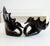 A sophisticated duo of hand-blown Italian art glass swans in a striking "Ebony" finish. These pieces are graduated in...