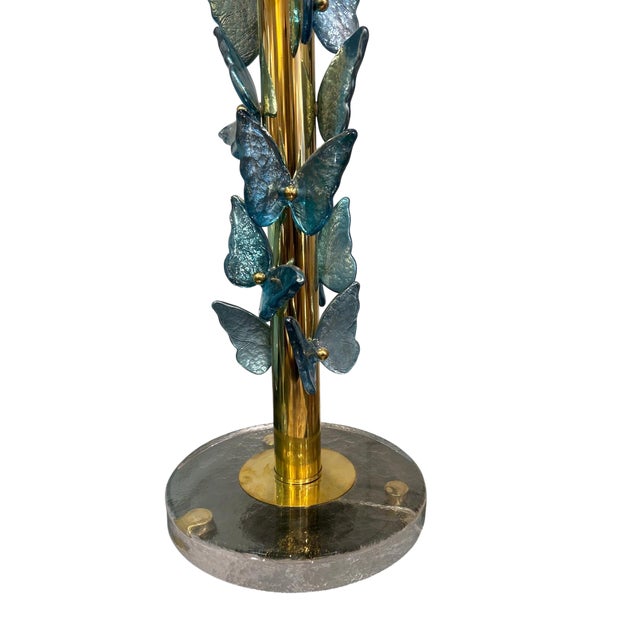 Murano glass butterfly lamp made of brass and Murano glass. Features multiple butterflies crafted from Murano glass. The...