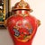 Red Pair of Chinese Cloisonné Vases | Red Ground Dragon & Phoenix Motif With Stands For Sale - Image 8 of 9
