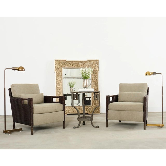 Sleek pair of matching mid-century modern pharmacy floor lamps featuring a desirable patinated finish on the brass. The...