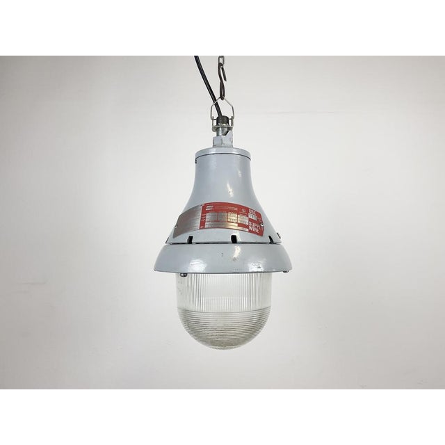 Industrial explosion proof light made by Crouse-Hinds in United States during the 1970s. It features a cast aluminium body...
