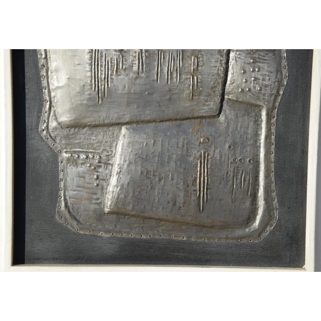 Hermann Tomada 1907 Höchst (Odenwald) – 1990 Darmstadt ‘Group of People’ Metal relief on a wooden panel, framed [original...