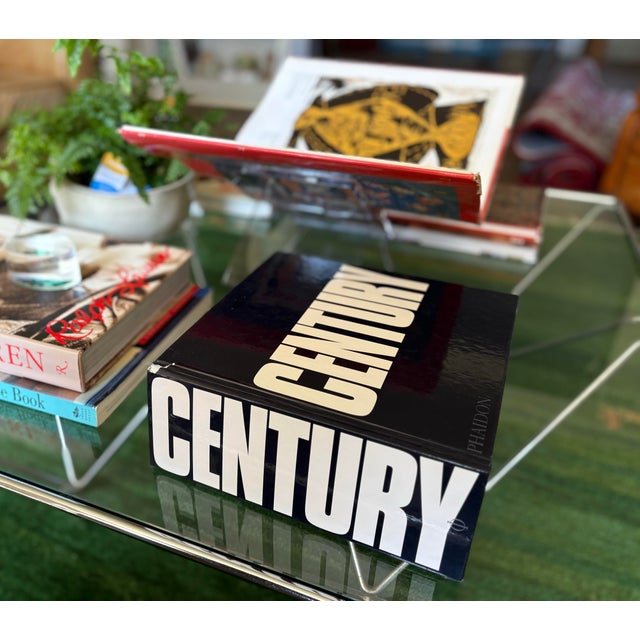 Bold and visually striking oversized Century coffee table book published by Phaidon, featuring an extensive survey of...