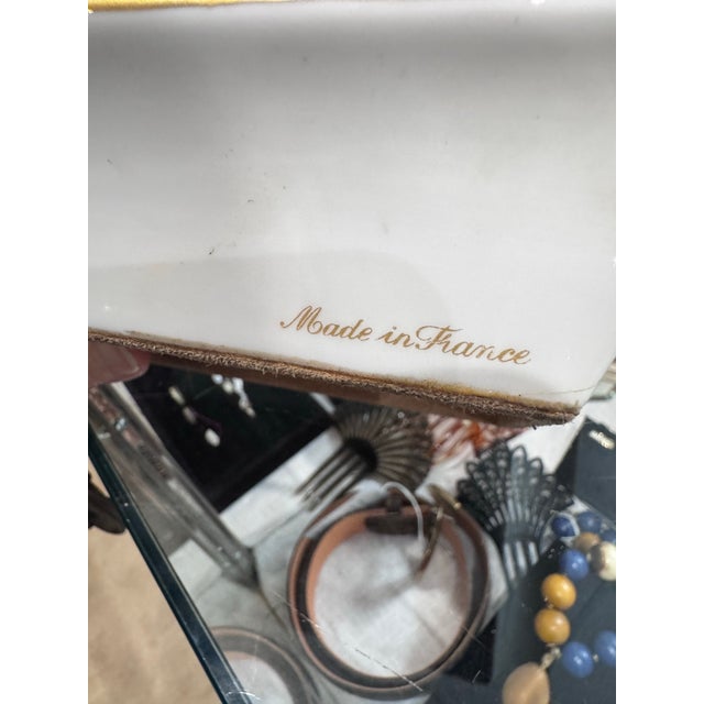 A stunning vintage Hermès Paris porcelain ashtray, beautifully decorated with a delicate orchid and butterfly motif framed...